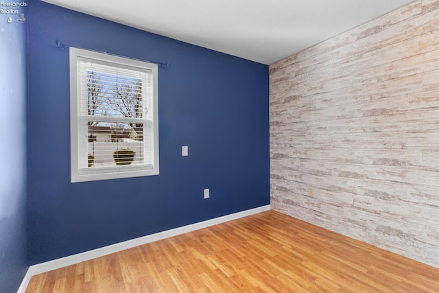 spare room featuring hardwood / wood-style flooring