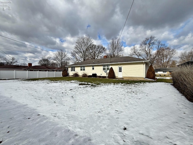 view of snow covered house