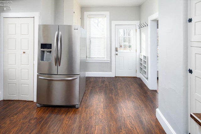 kitchen with dark hardwood / wood-style floors and stainless steel fridge