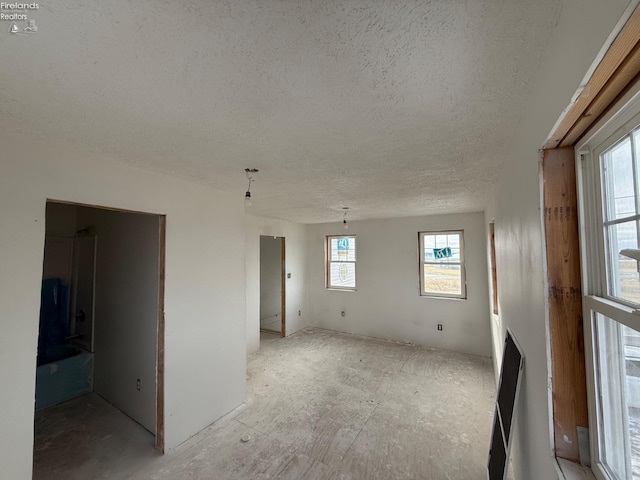 spare room featuring a textured ceiling