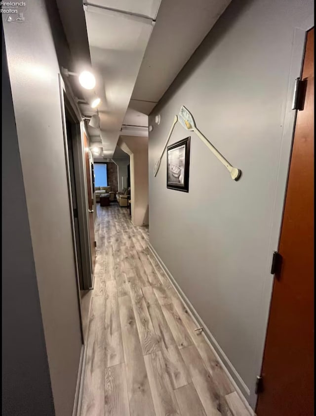 hallway with light wood-type flooring