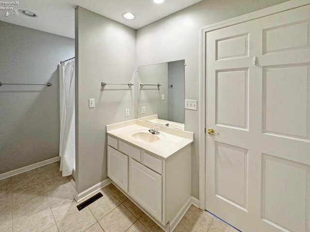 bathroom featuring vanity, tile patterned floors, and a shower with shower curtain