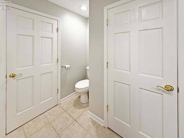 bathroom featuring tile patterned floors and toilet