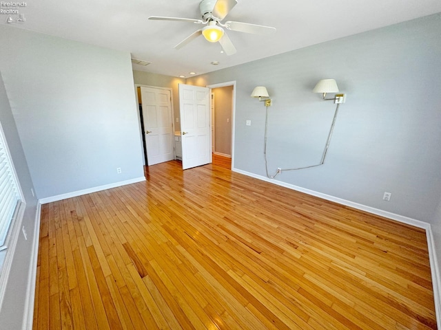 unfurnished room with light hardwood / wood-style floors and ceiling fan