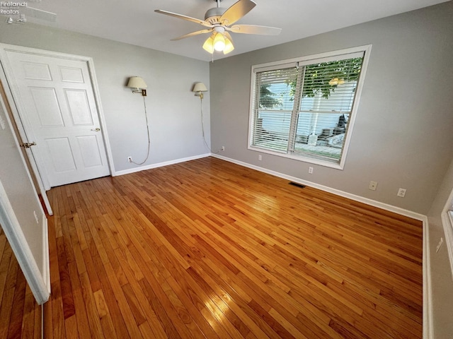 unfurnished bedroom featuring wood-type flooring and ceiling fan