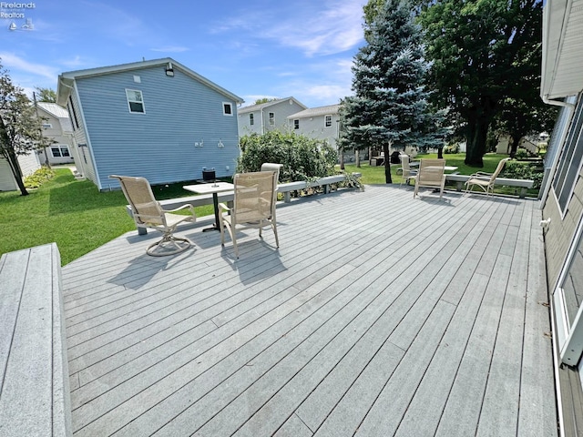 deck featuring a lawn