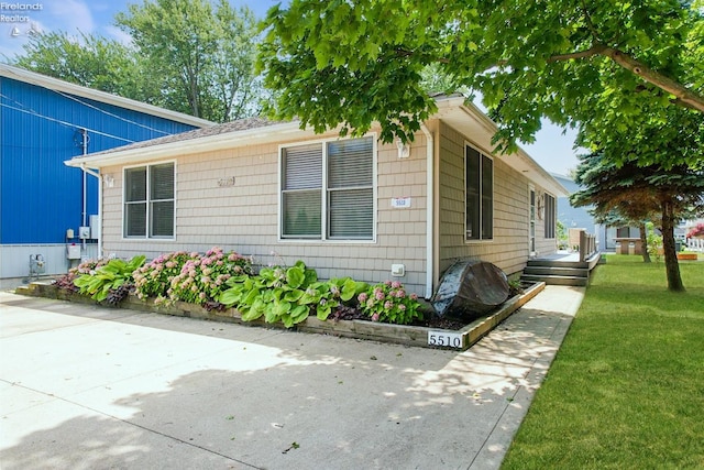 view of home's exterior featuring a yard