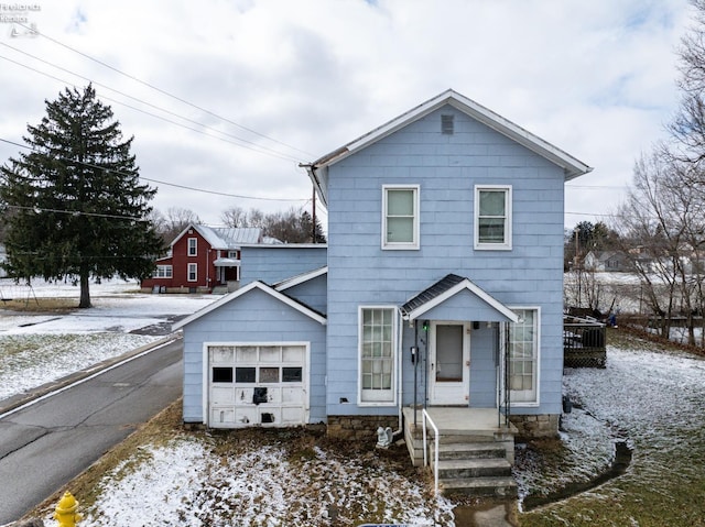 view of front of property featuring a garage