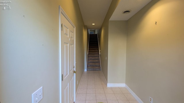 hallway with light tile patterned floors