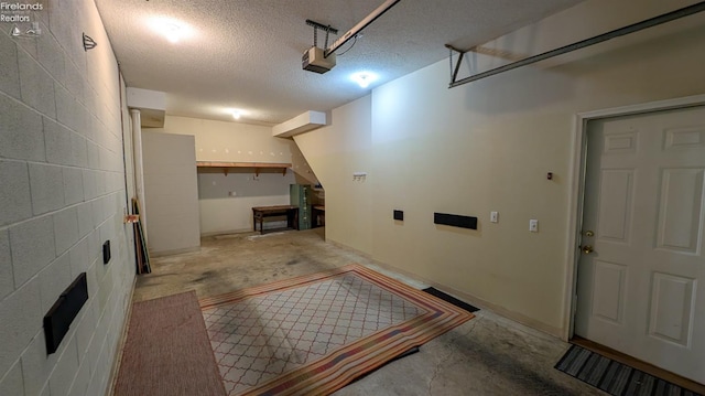 laundry area featuring a textured ceiling