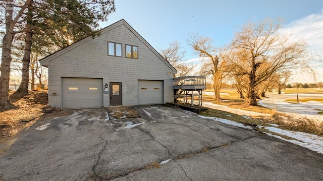 view of side of home featuring a wooden deck