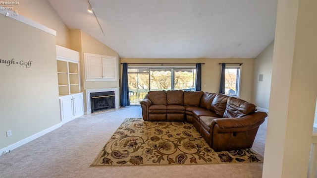 living room with vaulted ceiling and light carpet