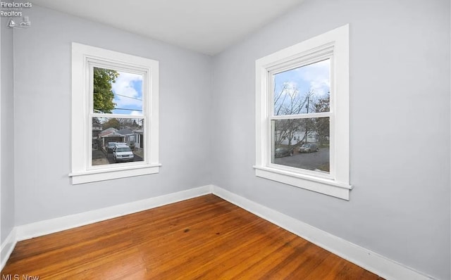 spare room featuring hardwood / wood-style floors