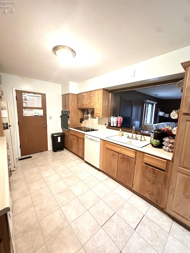 kitchen featuring sink and black appliances