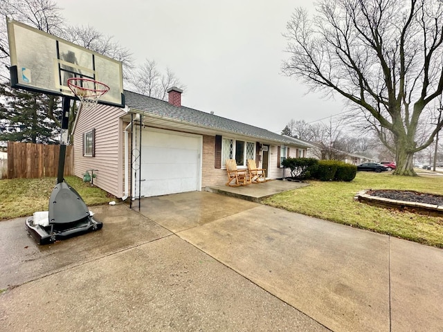 exterior space featuring a garage and a lawn