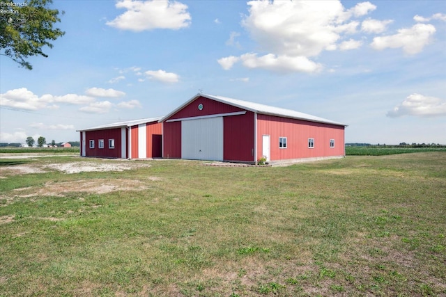 view of outbuilding with a yard