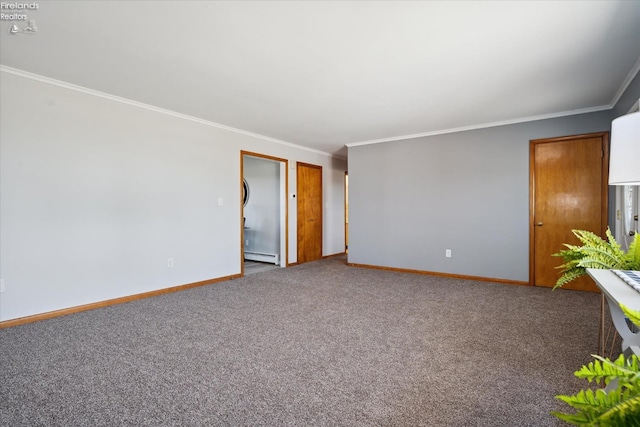 carpeted empty room with baseboard heating and crown molding