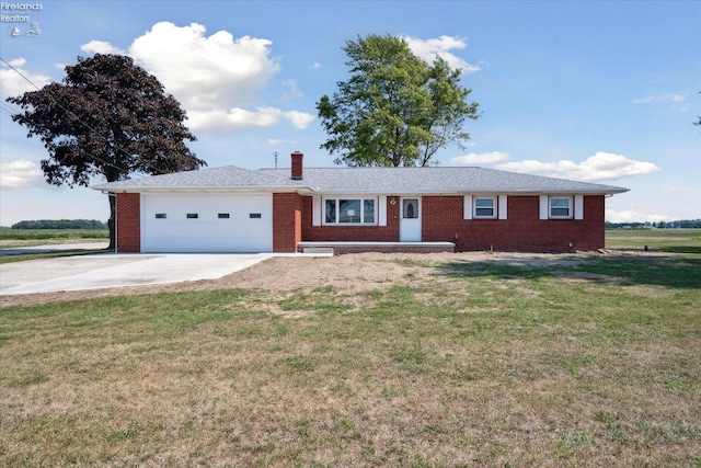 ranch-style home with a garage and a front yard