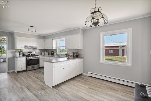 kitchen with pendant lighting, stainless steel gas range, white cabinetry, a baseboard heating unit, and light stone counters