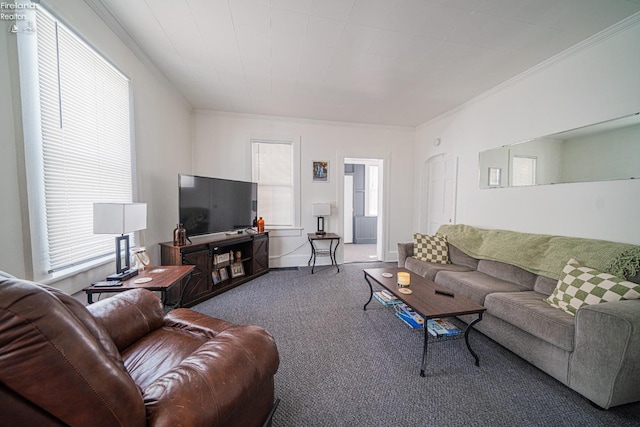 carpeted living room with ornamental molding