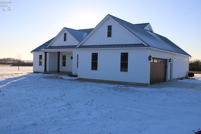 modern farmhouse featuring a garage