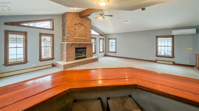 unfurnished living room featuring plenty of natural light, a baseboard radiator, vaulted ceiling with beams, a wall mounted AC, and a brick fireplace