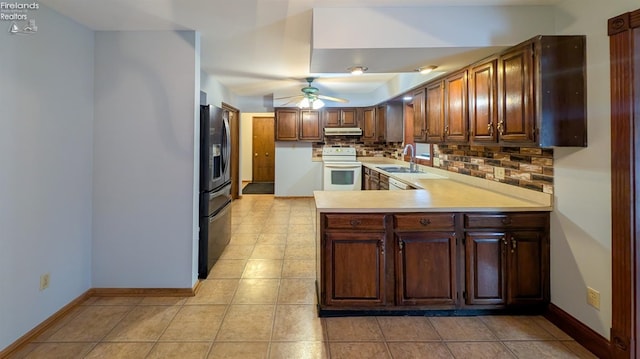 kitchen featuring sink, white electric range, stainless steel fridge, tasteful backsplash, and kitchen peninsula