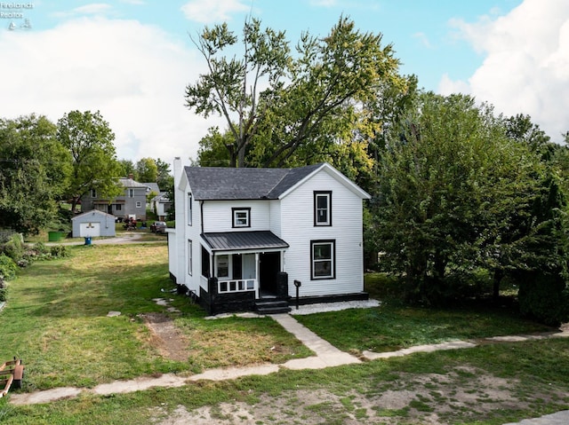 view of front of home featuring a porch and a front lawn