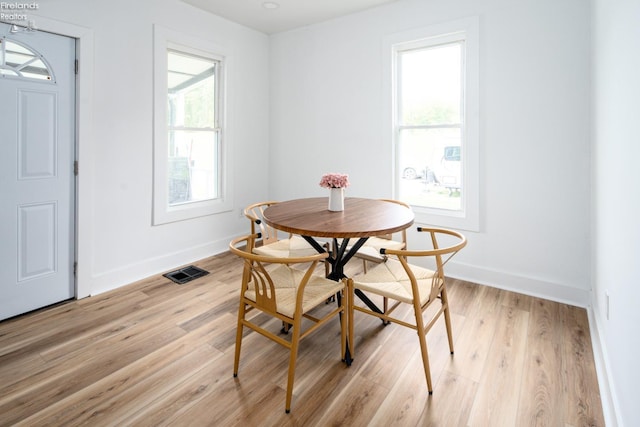 dining room with light hardwood / wood-style flooring and breakfast area