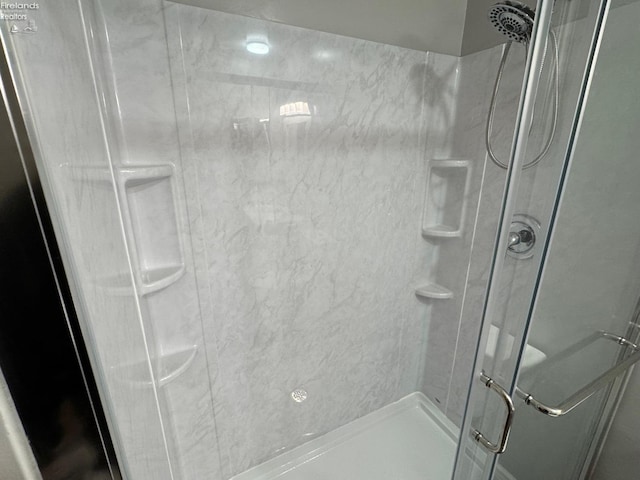 bathroom with an enclosed shower