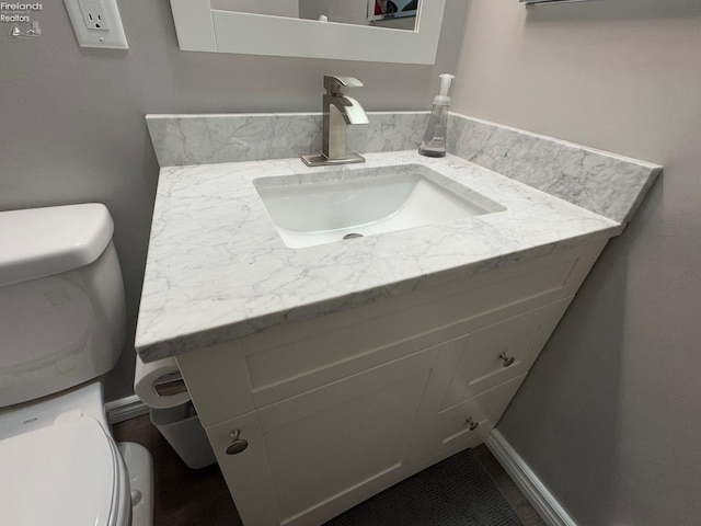 bathroom with vanity and toilet