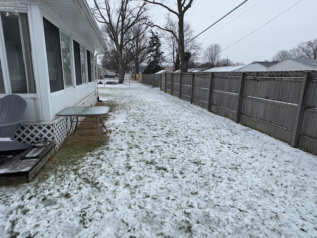 view of yard covered in snow