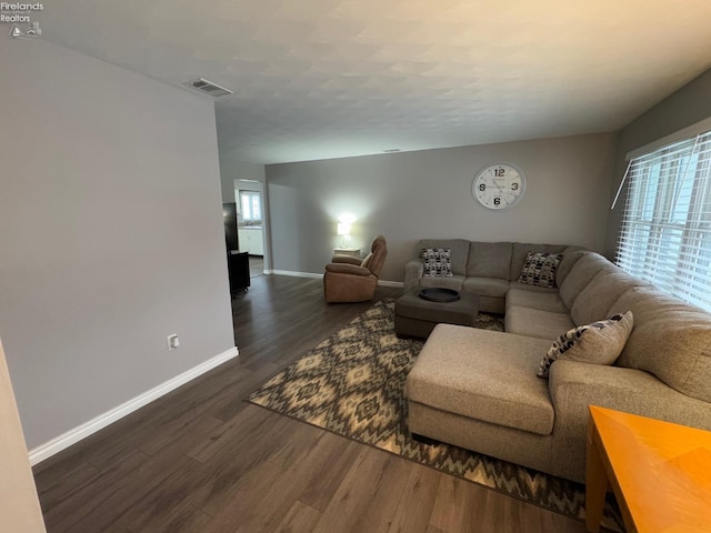 living room featuring dark hardwood / wood-style floors