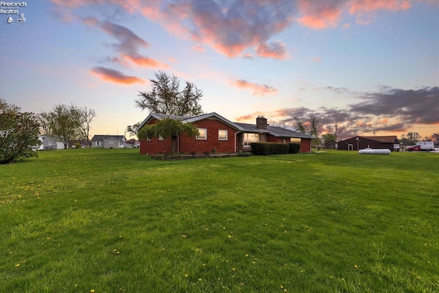 view of yard at dusk