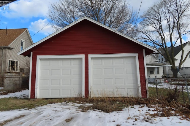 view of snow covered garage