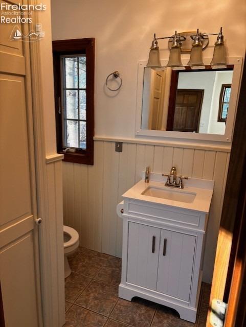 bathroom with vanity, toilet, and tile patterned flooring