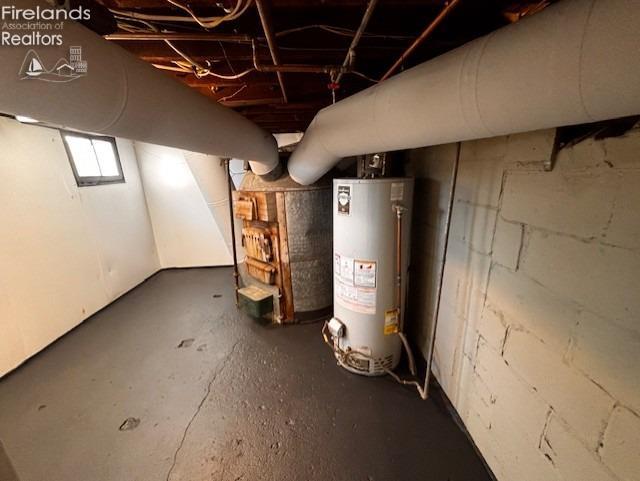 basement featuring water heater