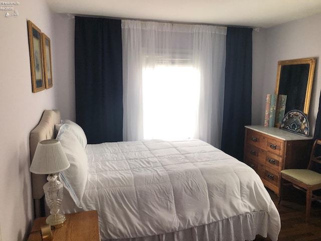 bedroom with wood-type flooring