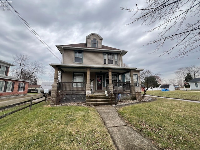 view of front of house featuring a porch and a front lawn