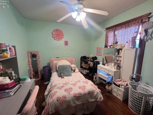 bedroom featuring ceiling fan and dark hardwood / wood-style flooring