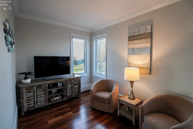 living area with dark wood-type flooring and crown molding