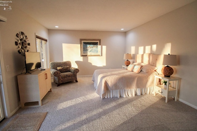 bedroom featuring light colored carpet