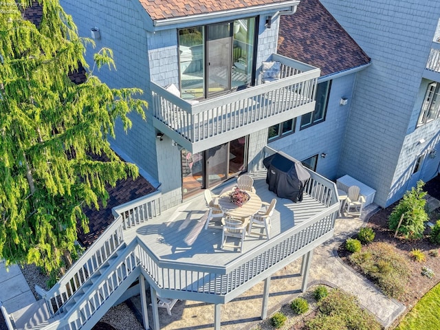 back of house featuring a balcony