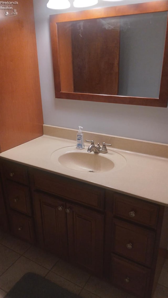 bathroom with vanity and tile patterned floors