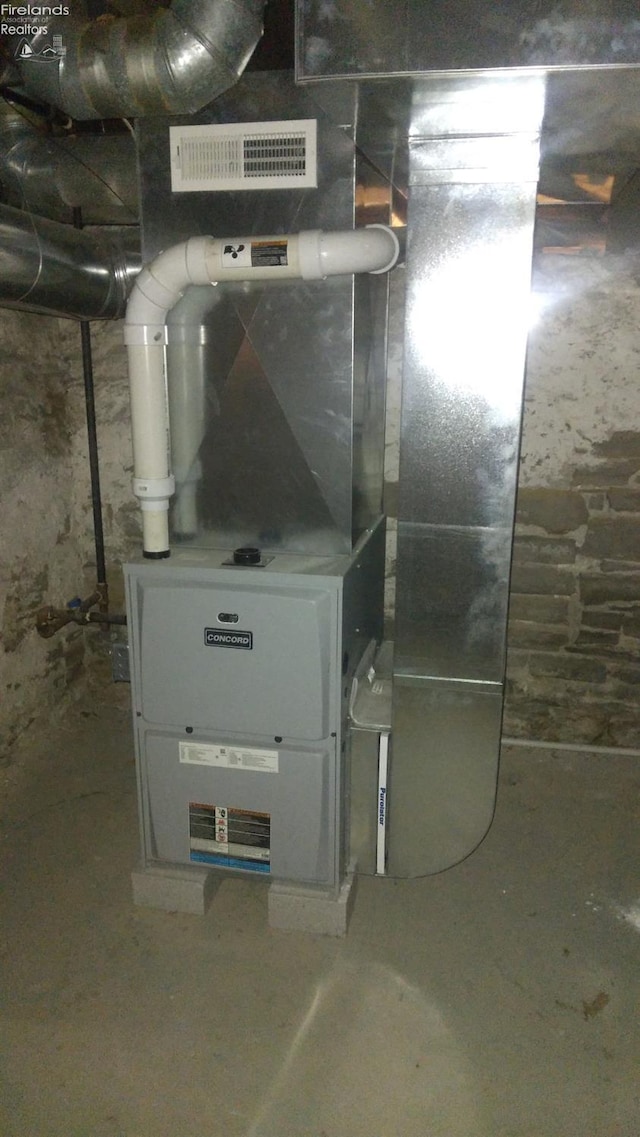 utility room with heating unit