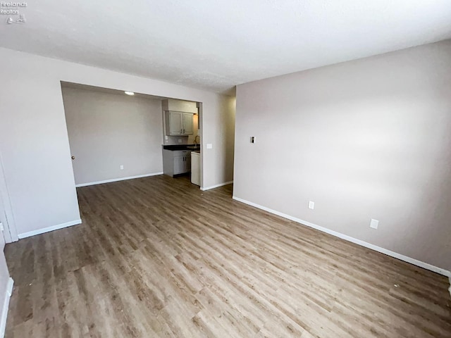 unfurnished room featuring hardwood / wood-style floors