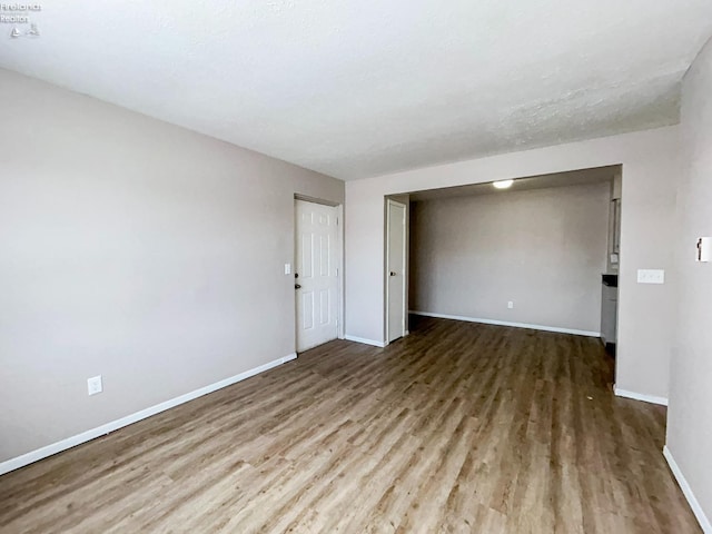 empty room featuring hardwood / wood-style flooring