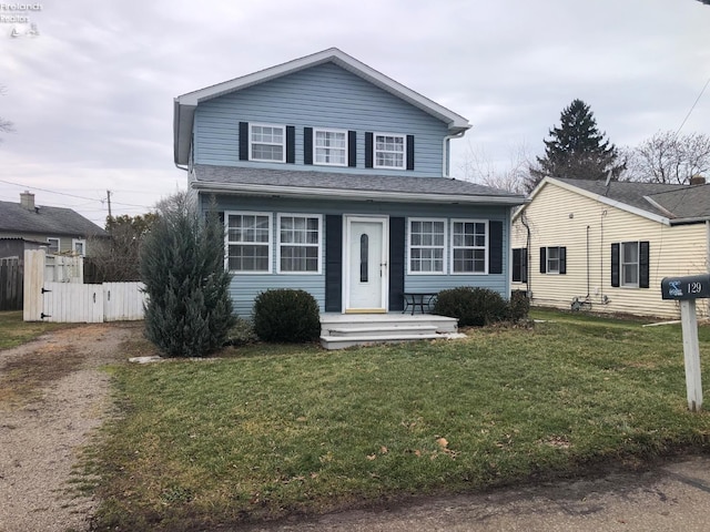 view of property featuring a front yard