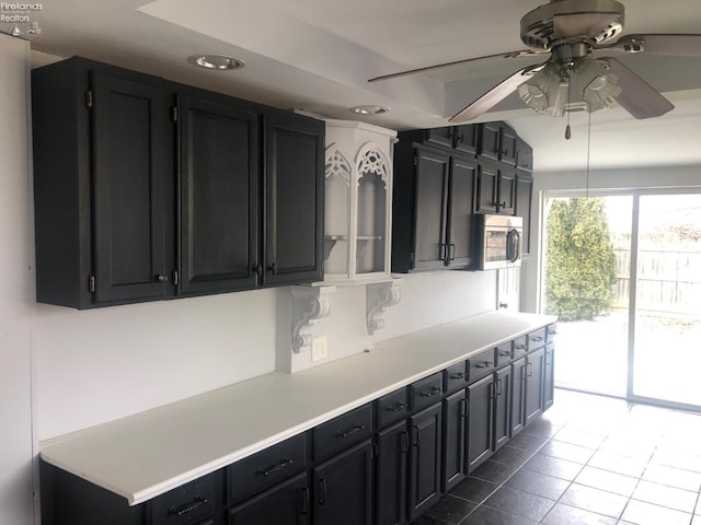 kitchen featuring tile patterned flooring and ceiling fan