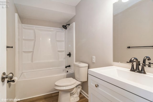 full bathroom with vanity, hardwood / wood-style flooring, bathing tub / shower combination, and toilet